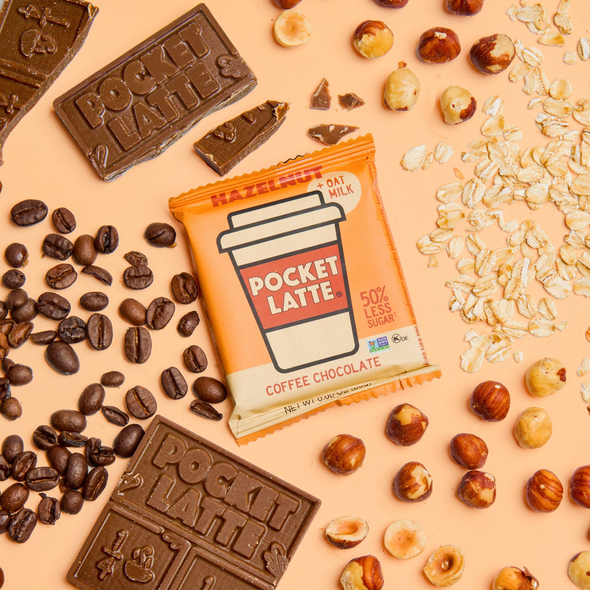 A Pocket Latte Hazelnut coffee chocolate bar with coffee beans, chocolate pieces, oats, and hazelnuts
