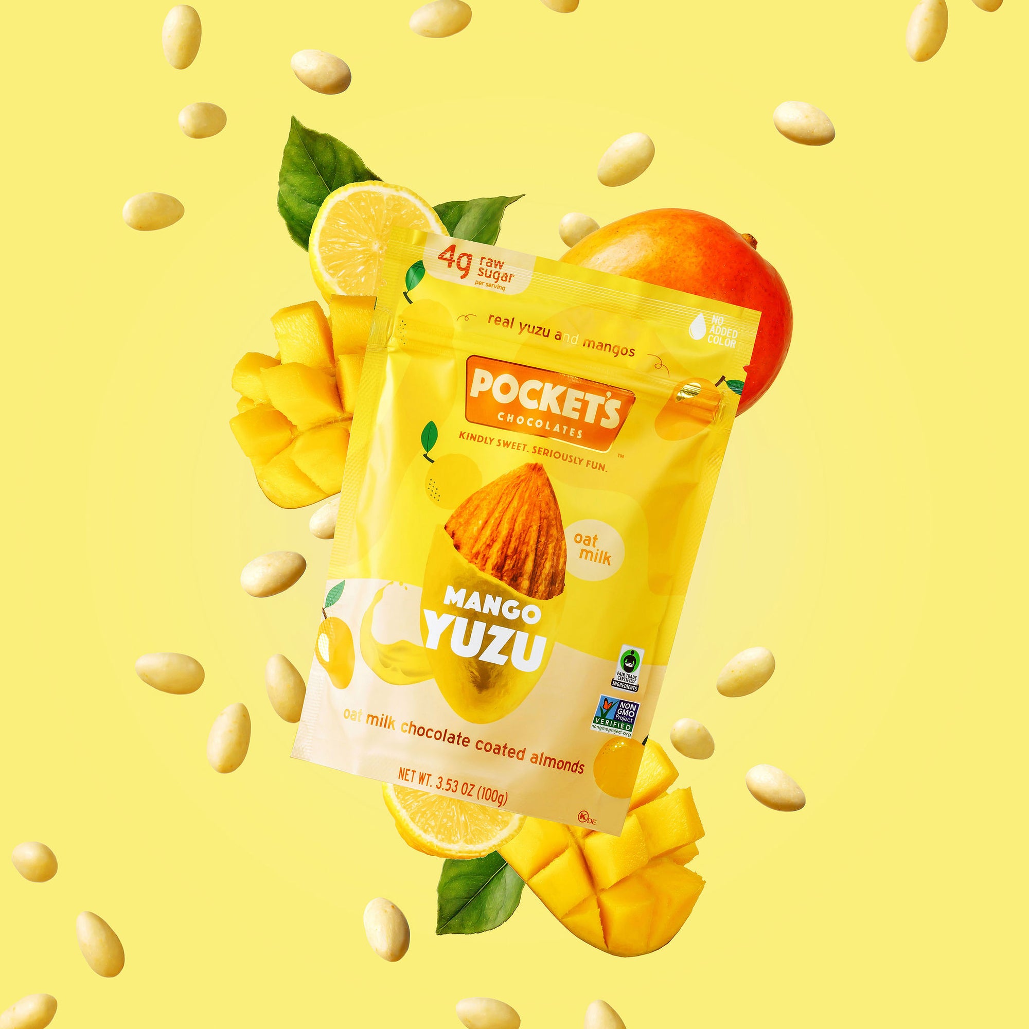 Bright yellow packaging of Pockets Chocolate Mango Yuzu flavor with milk chocolate coated almonds and fruit illustrations
