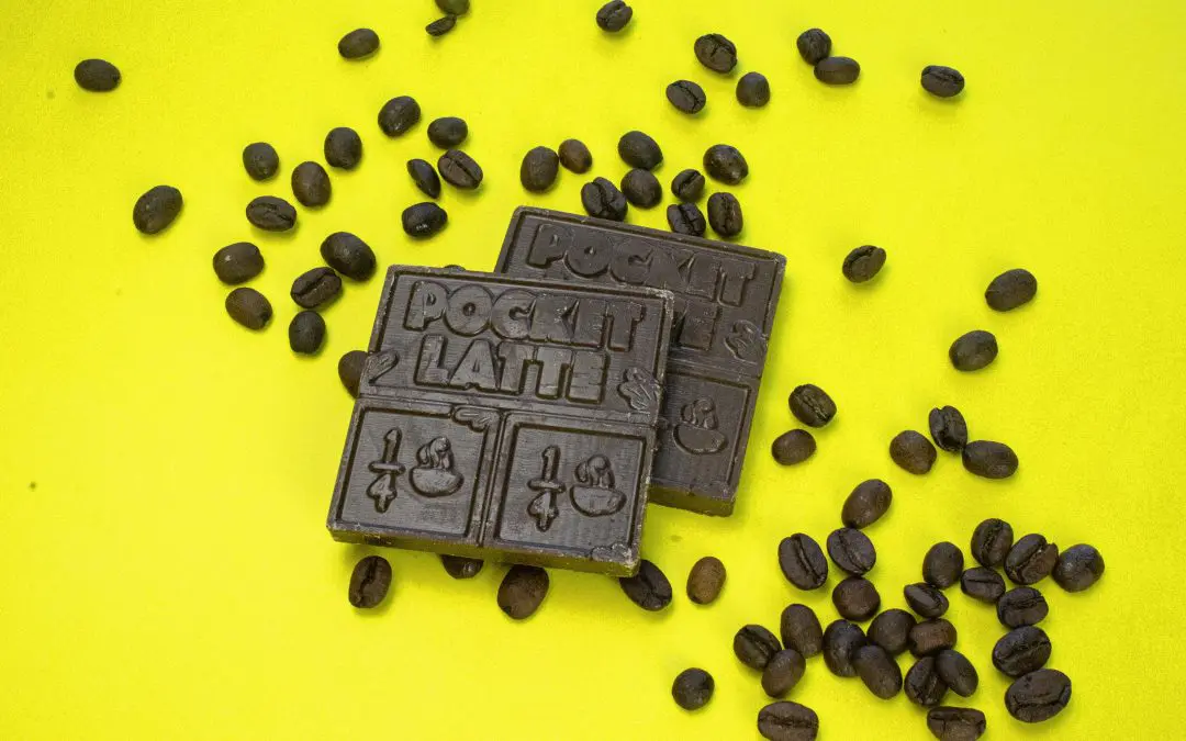 Pocket's Chocolates' Dark Roast coffee chocolate bars shown on a table with coffee beans.